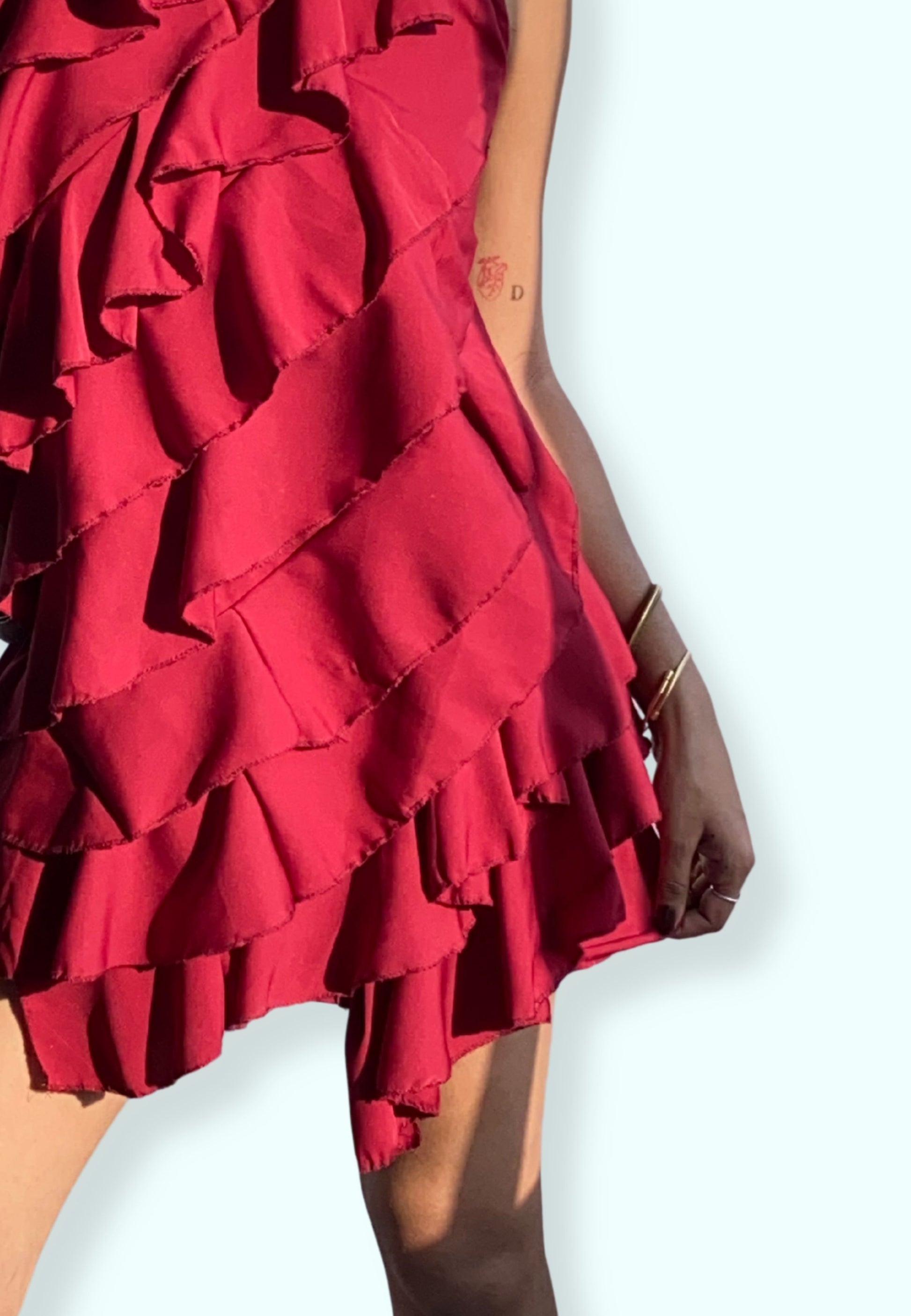 Red ruffled dress on a white background